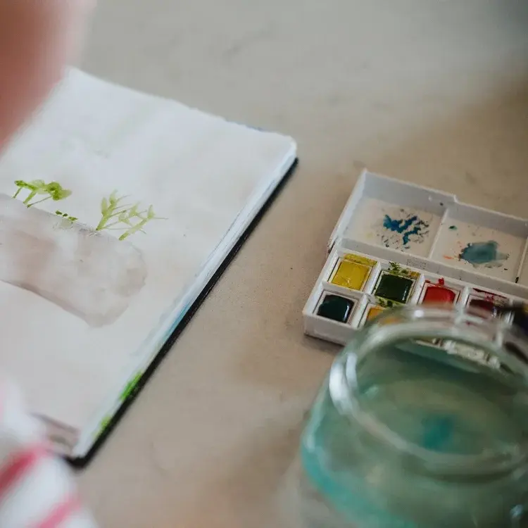 Closeup watercolors and notebook