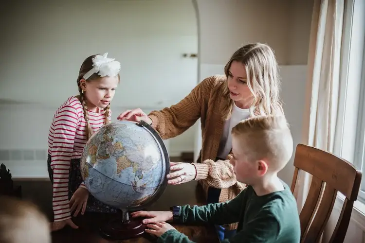 Family looking at globe